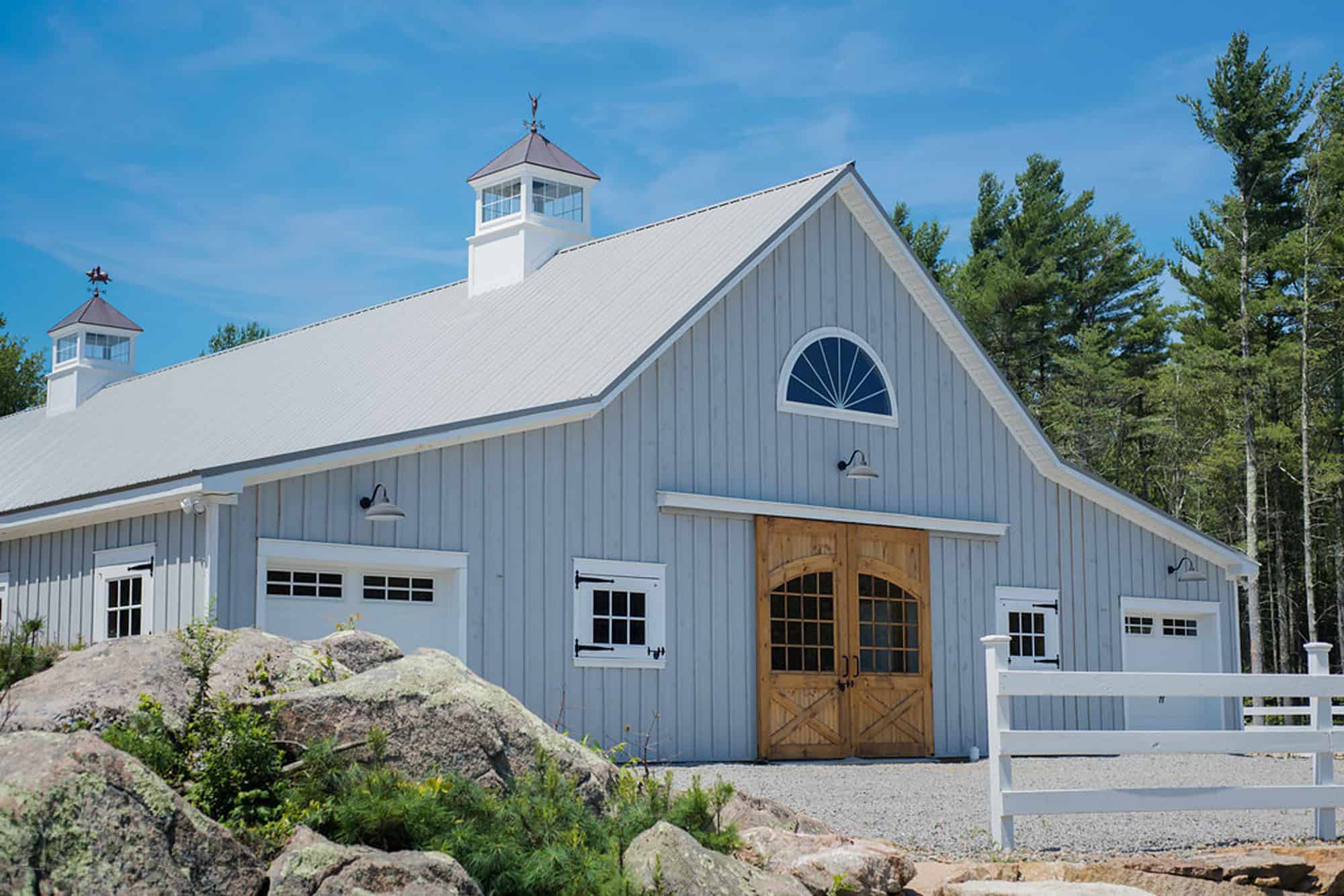 horse stalls cupola half circle window barn doors