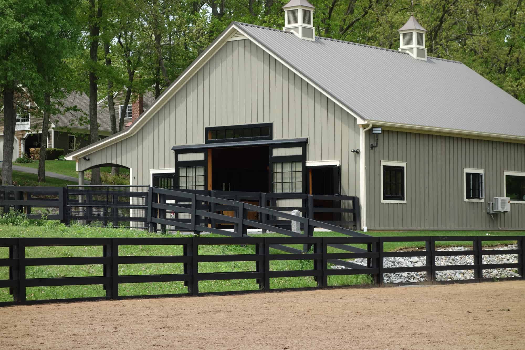 cupola metal roof horse stalls black fence