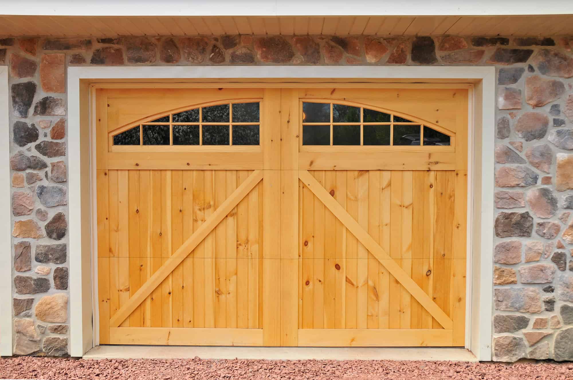 barn doors stonework garage with living quarters