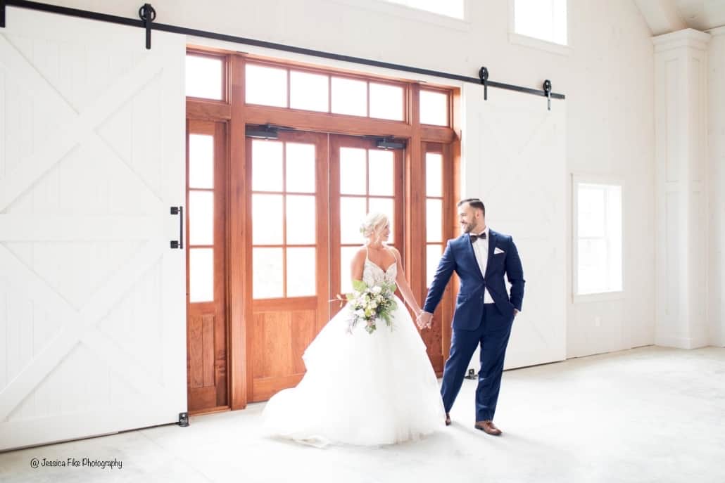 bride and groom barn doors party barn