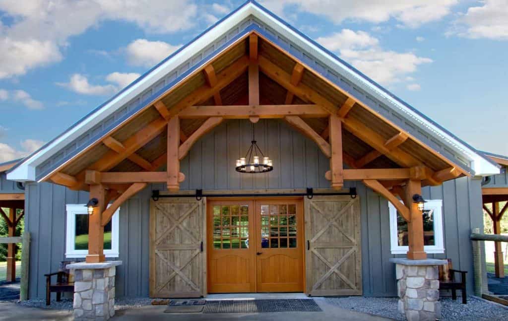 Historic barn-inspired building with classic wood and stone exterior detail.