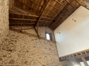 restored stone wall in old adaptive reuse barn