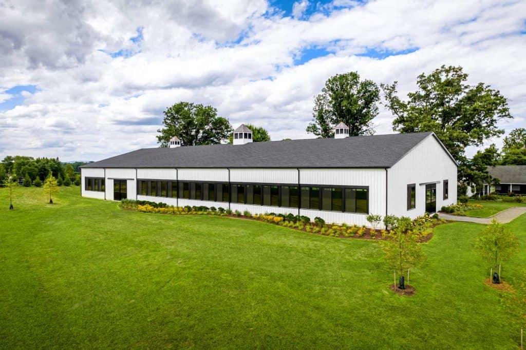 Bright, contemporary quarry view building with large windows and landscaped surroundings.