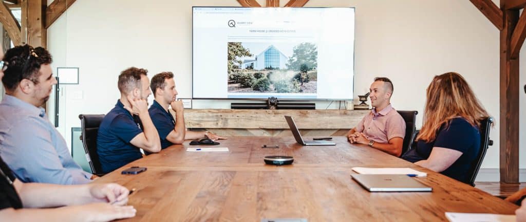 Conference room with Quarry View branding presentation.