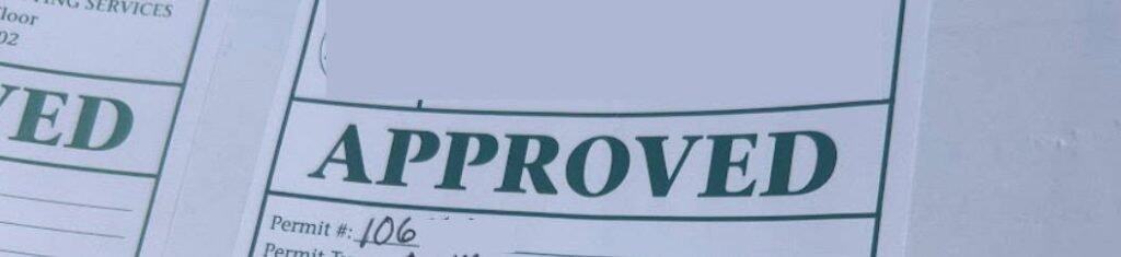 Approved construction permit sign in image.