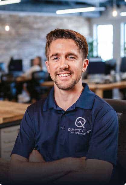 Friendly team member at Quarry View Building Group office.