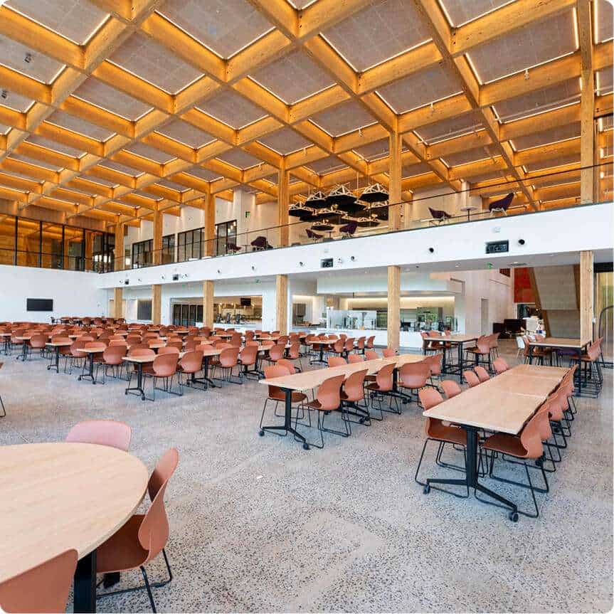 Spacious interior of Quarry View building with timber ceiling, open layouts, and contemporary furnishings.