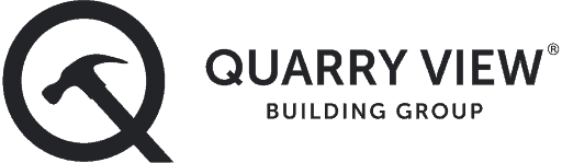 Modern commercial building exterior with Quarry View Building Group logo.