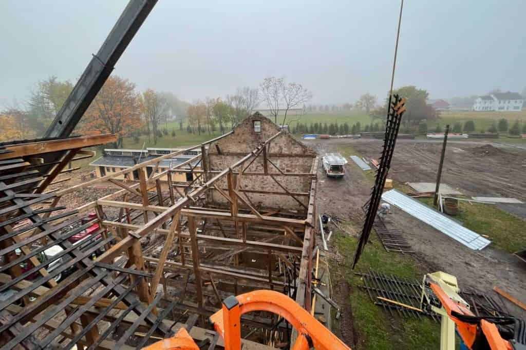 Construction site at Quarry View Building Group featuring ongoing wooden framing for a new building.