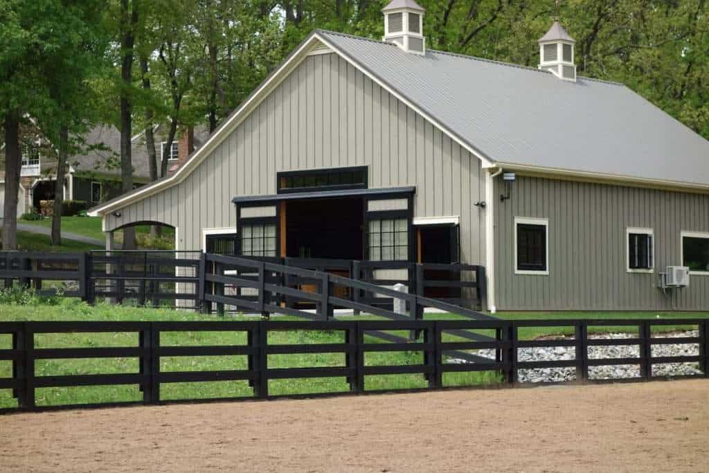 Elegant barn with black accents and spacious ramp for versatile use.