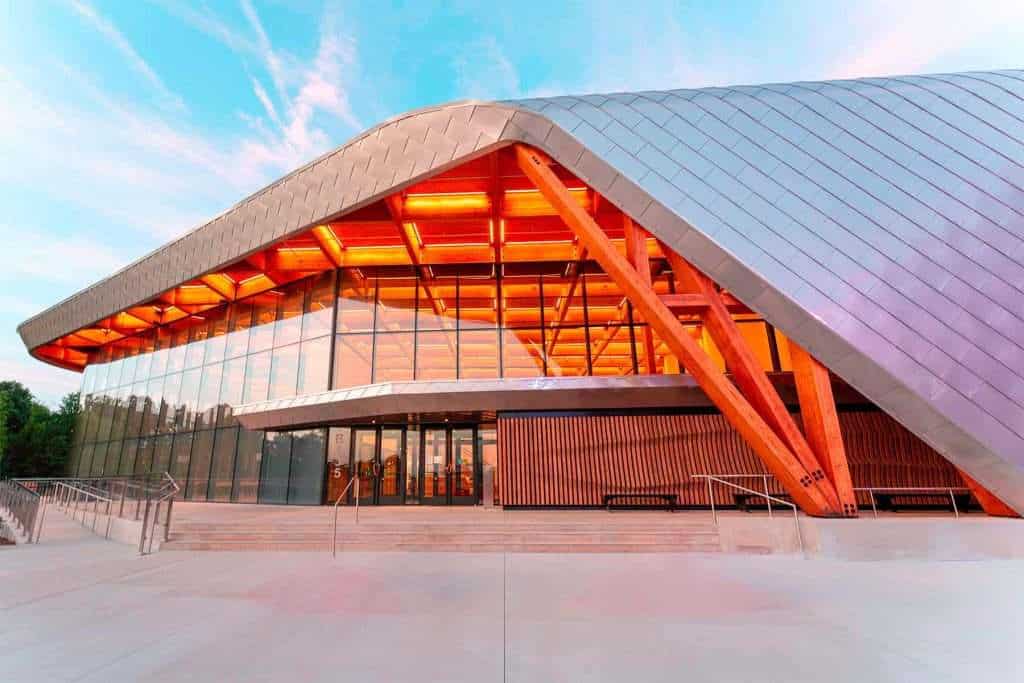 Spectacular building with glass facade, wood accents, and contemporary design from Quarry View Building Group.