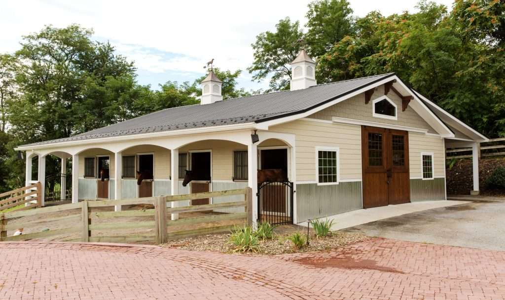 Horse barn with stalls by Quarry View Building Group, featuring classic design and functional features.