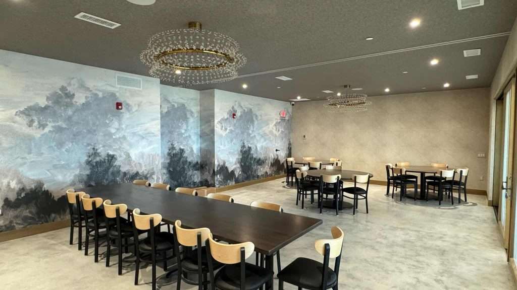 Elegant interior design of a commercial building with contemporary lighting and wall art.