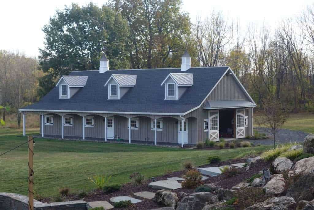 Barn-style building with modern roofing and landscaping, designed by Quarry View Building Group.
